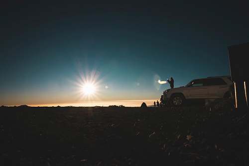mauna kea white car parked during sunset sky